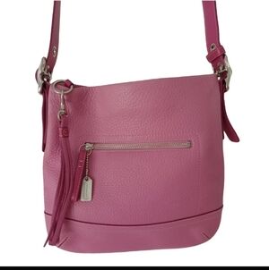 Coach Legacy Soft Pebbled Leather Medium Slim Zip Crossbody bag in pink.